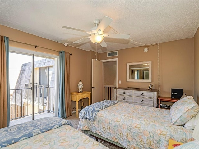 carpeted bedroom with a textured ceiling, access to outside, a ceiling fan, and visible vents