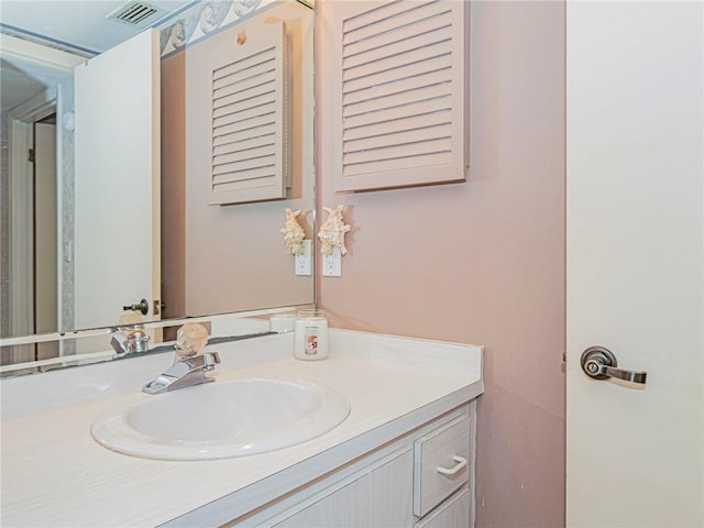 bathroom with visible vents and vanity