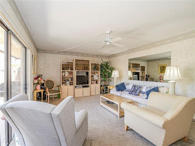 living room with ceiling fan, a textured ceiling, crown molding, and carpet floors