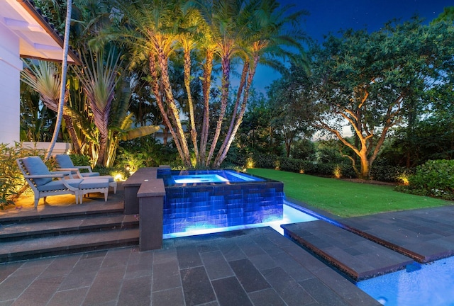 232 Bears Club Dr, Jupiter, FL 33477 - view of pool featuring a yard, an in ground hot tub, and a patio area