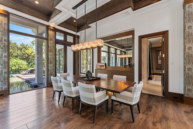 232 Bears Club Dr, Jupiter, FL 33477 - dining room with baseboards, beamed ceiling, a notable chandelier, and dark wood-style floors