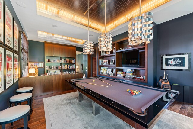 232 Bears Club Dr, Jupiter, FL 33477 - playroom with pool table, a raised ceiling, a chandelier, and dark wood-style flooring