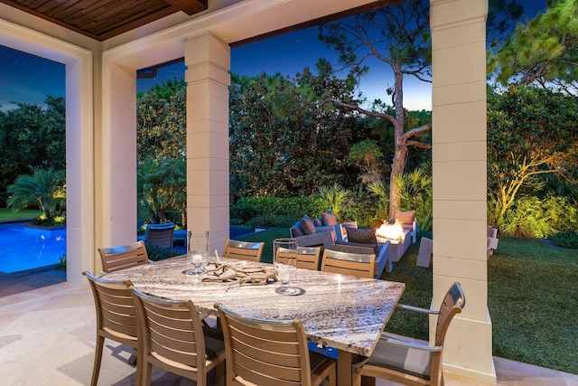 232 Bears Club Dr, Jupiter, FL 33477 - view of patio featuring outdoor dining area and a fire pit