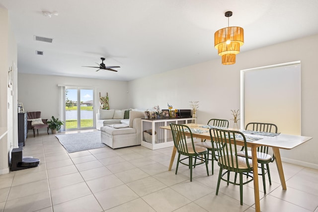 4235 Troon Pl, Fort Pierce, FL 34947 - dining area with a ceiling fan, light tile patterned flooring, baseboards, and a water view
