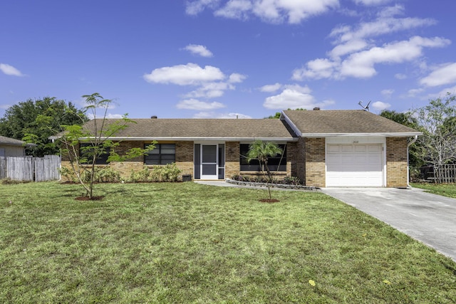 2426 SE Stonecrop St, Port Saint Lucie, FL 34984 - single story home featuring concrete driveway, brick siding, fence, and an attached garage