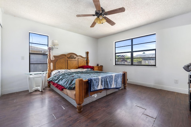 2426 SE Stonecrop St, Port Saint Lucie, FL 34984 - bedroom featuring baseboards, a ceiling fan, a textured ceiling, and wood finished floors