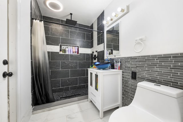 2426 SE Stonecrop St, Port Saint Lucie, FL 34984 - bathroom with tile walls, toilet, marble finish floor, vanity, and tiled shower