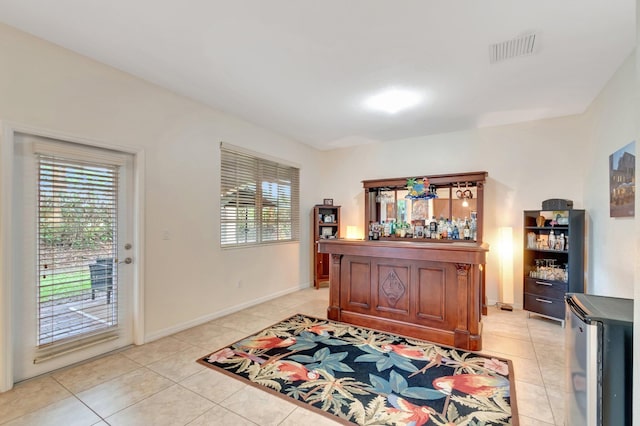 6805 Osage Cir, Greenacres, FL 33413 - office area featuring plenty of natural light, light tile patterned flooring, a bar, and baseboards