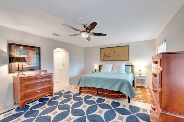 6805 Osage Cir, Greenacres, FL 33413 - bedroom featuring arched walkways, baseboards, and ceiling fan