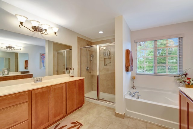 6805 Osage Cir, Greenacres, FL 33413 - full bathroom featuring tile patterned flooring, vanity, a shower stall, and a garden tub
