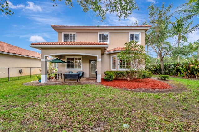 6805 Osage Cir, Greenacres, FL 33413 - rear view of property featuring a patio area, stucco siding, and a tiled roof