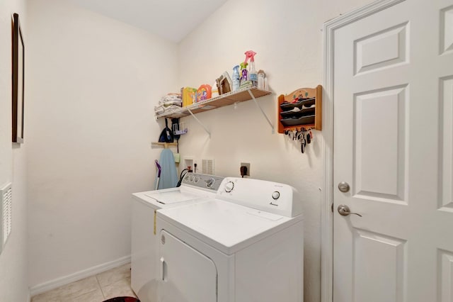 6805 Osage Cir, Greenacres, FL 33413 - washroom featuring washing machine and clothes dryer, baseboards, and light tile patterned floors