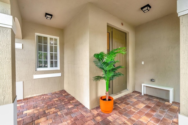 6805 Osage Cir, Greenacres, FL 33413 - view of exterior entry featuring stucco siding