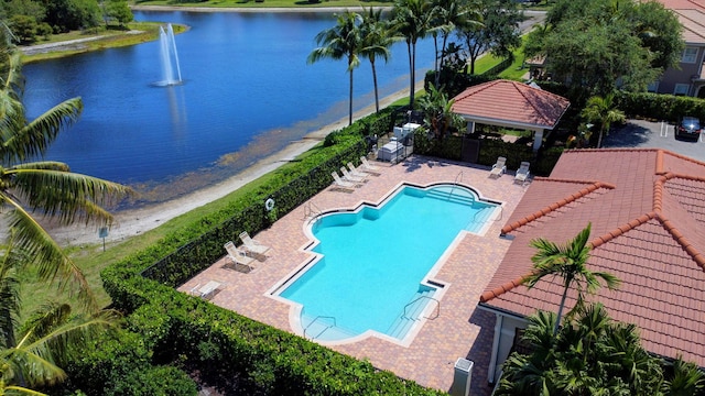 6805 Osage Cir, Greenacres, FL 33413 - community pool featuring a gazebo, a water view, and a patio area