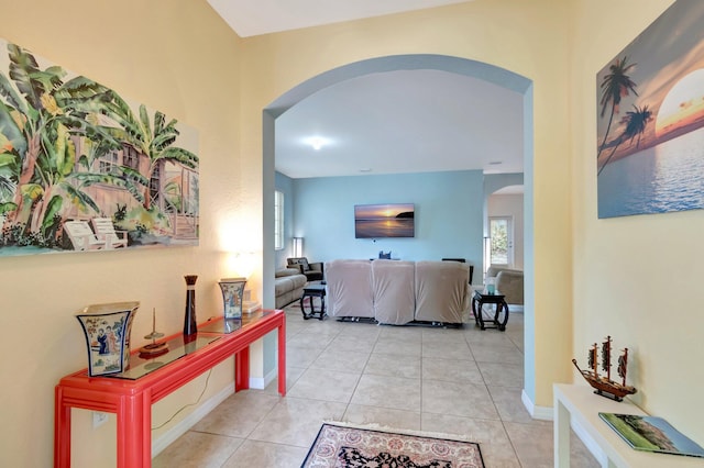 6805 Osage Cir, Greenacres, FL 33413 - hallway with arched walkways and light tile patterned floors