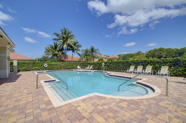 6805 Osage Cir, Greenacres, FL 33413 - community pool with a patio area and fence