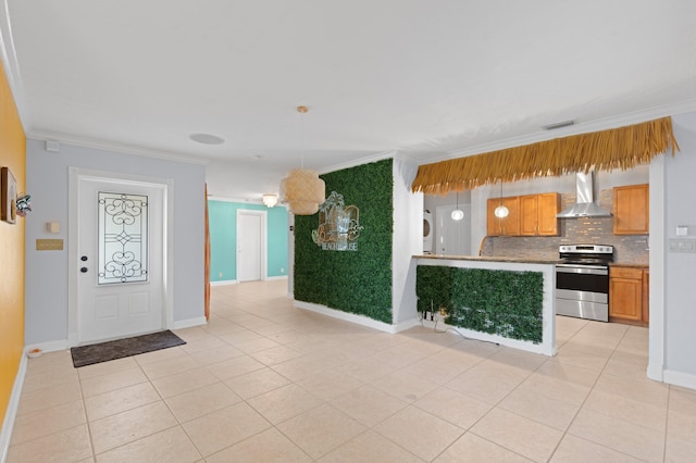 2650 NE 22nd St, Pompano Beach, FL 33062 - kitchen featuring electric range, crown molding, wall chimney range hood, tasteful backsplash, and light tile patterned floors