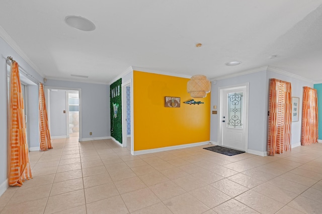 2650 NE 22nd St, Pompano Beach, FL 33062 - foyer featuring crown molding, light tile patterned floors, and baseboards