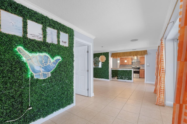 2650 NE 22nd St, Pompano Beach, FL 33062 - interior space featuring crown molding, light tile patterned floors, and baseboards
