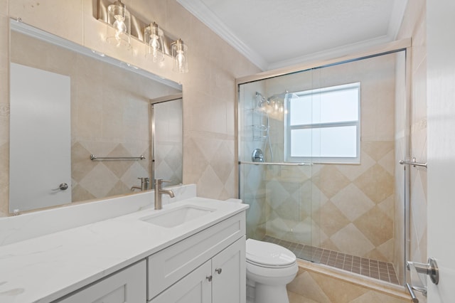 2650 NE 22nd St, Pompano Beach, FL 33062 - full bathroom with toilet, a stall shower, ornamental molding, vanity, and tile walls