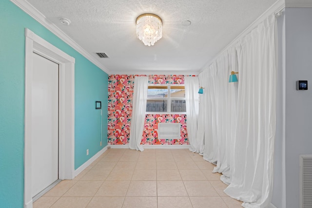 2650 NE 22nd St, Pompano Beach, FL 33062 - unfurnished room featuring a textured ceiling, baseboards, ornamental molding, light tile patterned flooring, and a smoke detector
