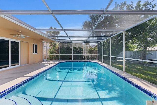 2650 NE 22nd St, Pompano Beach, FL 33062 - view of swimming pool featuring a fenced backyard, a ceiling fan, a patio area, and glass enclosure