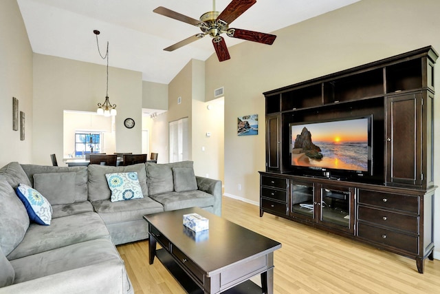 1961 SW 15th St Unit 82, Deerfield Beach, FL 33442 - living area with high vaulted ceiling, a ceiling fan, light wood finished floors, a chandelier, and baseboards