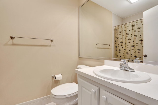 1961 SW 15th St Unit 82, Deerfield Beach, FL 33442 - bathroom with toilet, vanity, curtained shower, tile patterned flooring, and baseboards