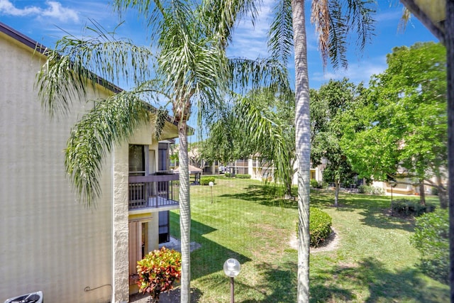 1961 SW 15th St Unit 82, Deerfield Beach, FL 33442 - view of grassy yard with a balcony
