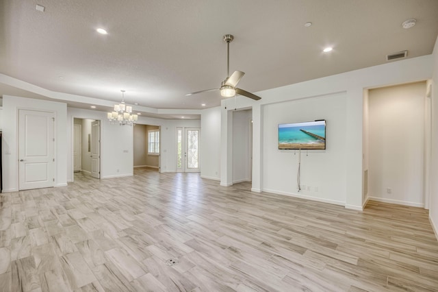 179 Tresana Blvd Unit 145, Jupiter, FL 33478 - unfurnished living room featuring a chandelier, a ceiling fan, recessed lighting, baseboards, and light wood finished floors