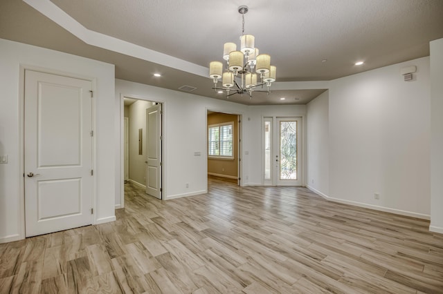 179 Tresana Blvd Unit 145, Jupiter, FL 33478 - spare room featuring a chandelier, light wood-style flooring, recessed lighting, and baseboards