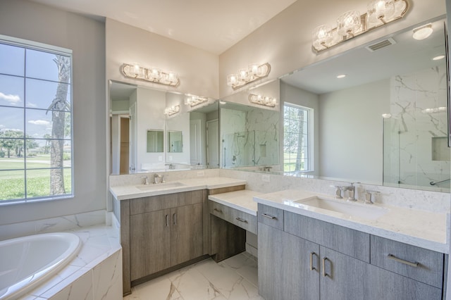 179 Tresana Blvd Unit 145, Jupiter, FL 33478 - full bath featuring plenty of natural light, marble look tile flooring, two vanities, and a garden tub