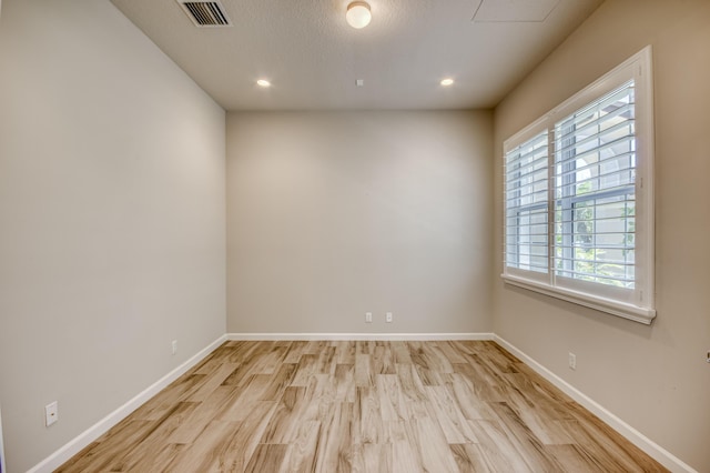 179 Tresana Blvd Unit 145, Jupiter, FL 33478 - unfurnished room featuring light wood-style floors, baseboards, and recessed lighting