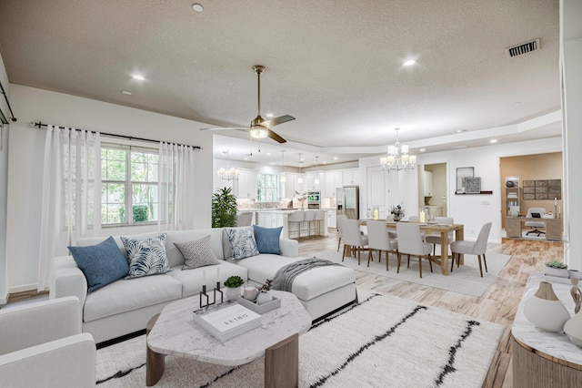179 Tresana Blvd Unit 145, Jupiter, FL 33478 - living area featuring a chandelier, a textured ceiling, light wood-style floors, a ceiling fan, and recessed lighting