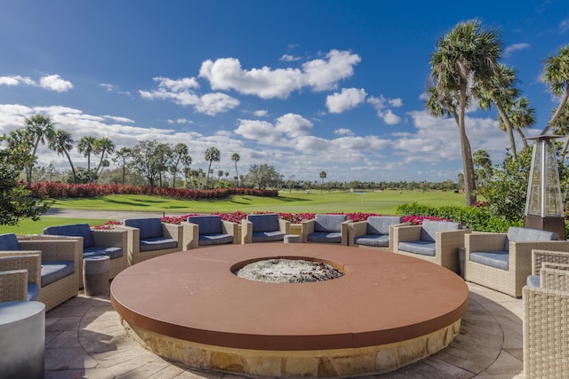179 Tresana Blvd Unit 145, Jupiter, FL 33478 - view of patio / terrace featuring golf course view and a fire pit