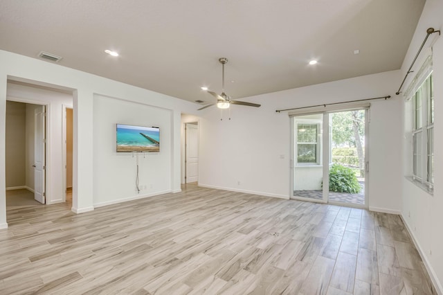 179 Tresana Blvd Unit 145, Jupiter, FL 33478 - unfurnished living room with ceiling fan, light wood finished floors, healthy amount of natural light, recessed lighting, and baseboards