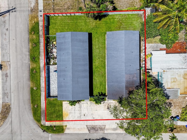 aerial view of property and surrounding area featuring property boundaries highlighted