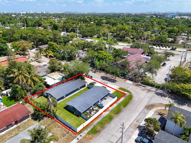 aerial view of property and surrounding area featuring property parcel outlined
