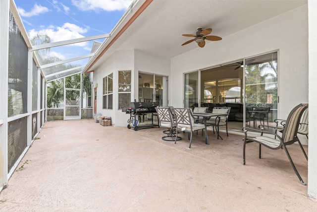sunroom with a ceiling fan