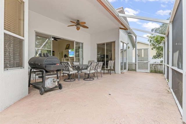 sunroom featuring outdoor dining space and ceiling fan