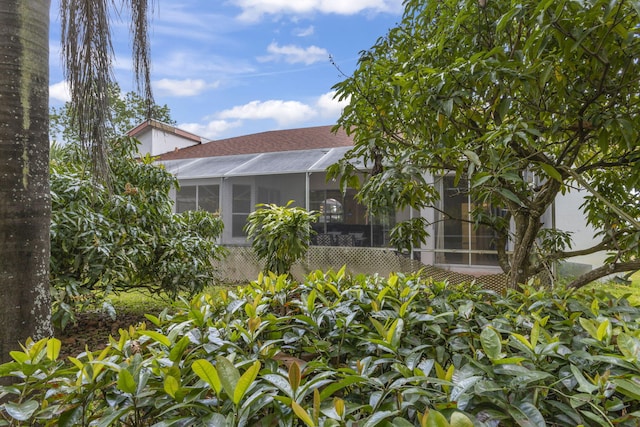 view of home's exterior featuring roof with shingles