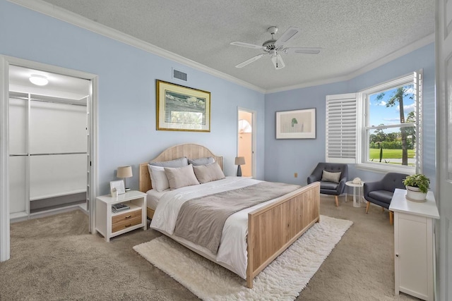 3003 Fairway Dr N, Jupiter, FL 33477 - bedroom featuring carpet, a textured ceiling, ornamental molding, a spacious closet, and a closet