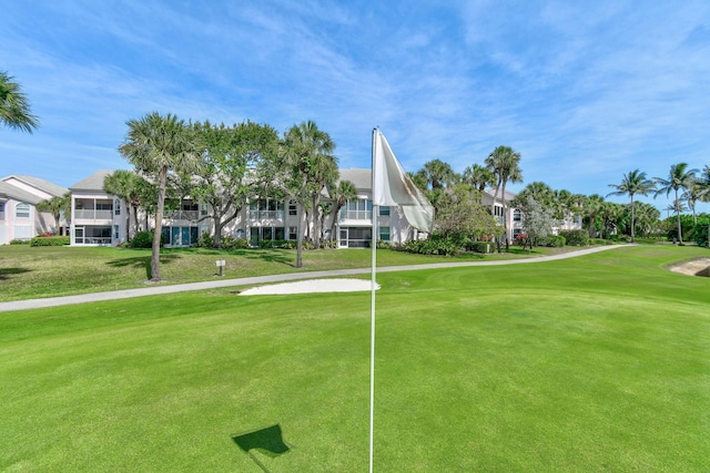 3003 Fairway Dr N, Jupiter, FL 33477 - view of property's community with golf course view, a lawn, and a putting green