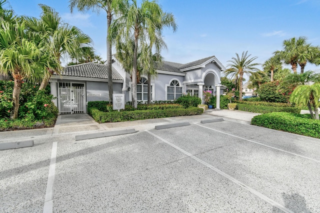 3003 Fairway Dr N, Jupiter, FL 33477 - view of building exterior featuring uncovered parking