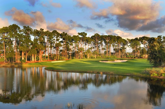 3003 Fairway Dr N, Jupiter, FL 33477 - view of community with golf course view, a lawn, and view of scattered trees