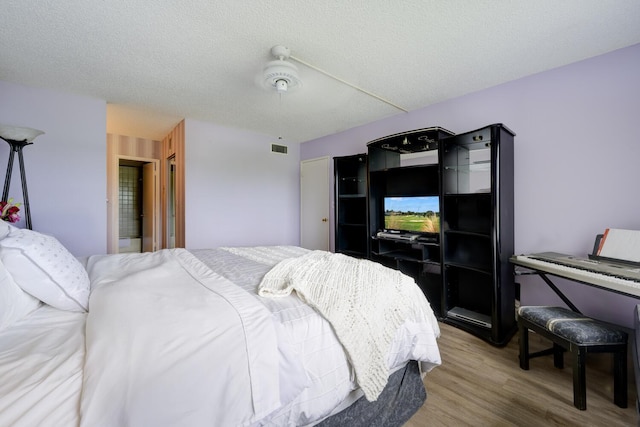 13403 Touchstone Pl Unit A-202, Palm Beach Gardens, FL 33418 - bedroom featuring wood finished floors