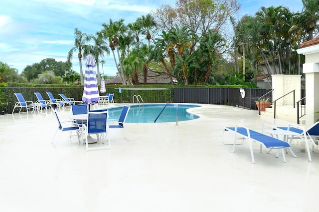 13403 Touchstone Pl Unit A-202, Palm Beach Gardens, FL 33418 - community pool featuring fence and a patio