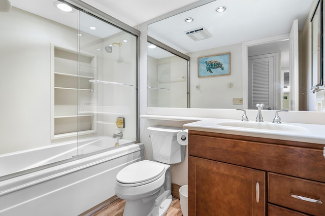 911 Gardenia Dr Unit 154, Delray Beach, FL 33483 - bathroom with vanity, toilet, combined bath / shower with glass door, and wood finished floors