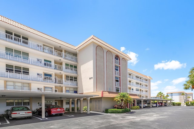 911 Gardenia Dr Unit 154, Delray Beach, FL 33483 - view of property featuring covered parking