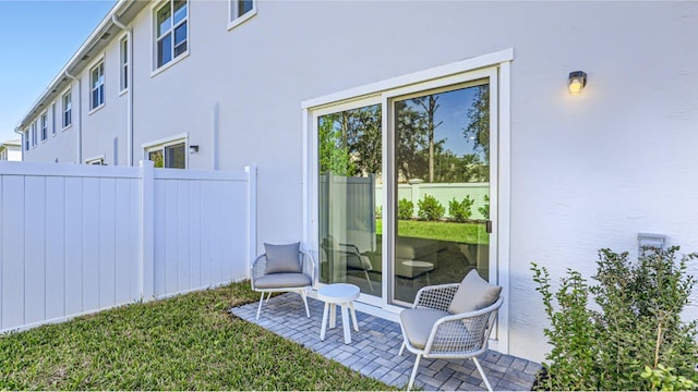 view of yard featuring a patio and fence